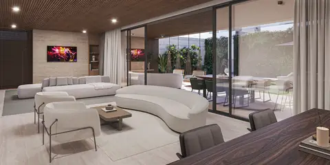 Living integrado ao jardim por grandes portas de vidro